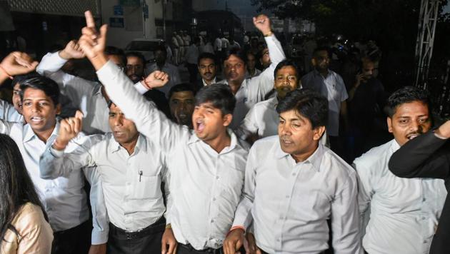 Lawyers raising slogans at Tis Hazari Court complex after clashes between lawyers and police personnel, in New Delhi on Saturday.(PTI Photo)