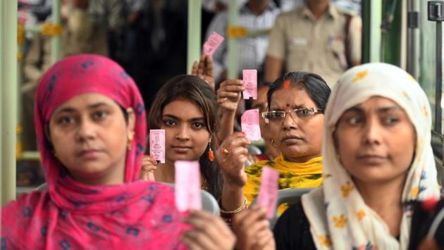 Women show pink ticket during their ride on a DTC Bus in New Delhi. The free of cost travel scheme for women in Delhi public buses began on October 29 with Deputy CM Manish Sisodia saying it will ensure their safety and increase their role in the national capital’s economy. (Raj K Raj / HT Photo)