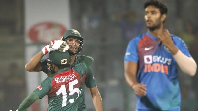 Bangladesh cricket team captain Mahmudullah, behind center, celebrates with Mushfiqur Rahim.(AP)