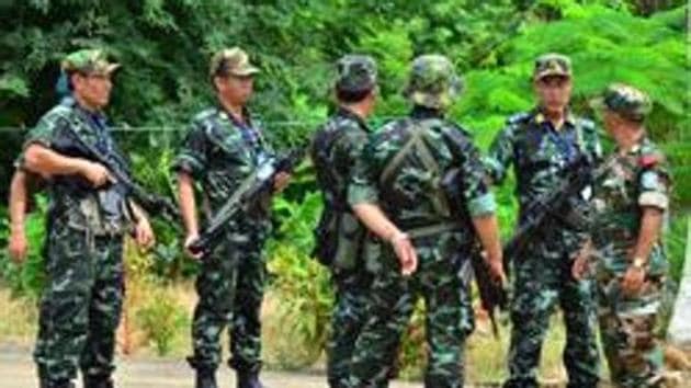 NSCN-IM rebels in and around their camp and the outfit's leader Thuingaleng Muivah with others.(File Photo)