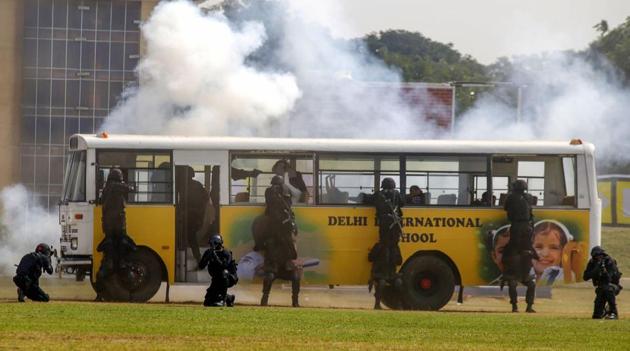National Security Guard commandos display their skills at the 35th Raising Day of National Security Guard, at Manesar in Gurugram. (PTI photo) National Security Guard commandos display their skills at the 35th Raising Day of National Security Guard, at Manesar in Gurugram. (PTI photo)