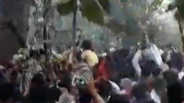 People throng to touch sacred tree. (SOURCED) People throng to touch sacred tree. (SOURCED)