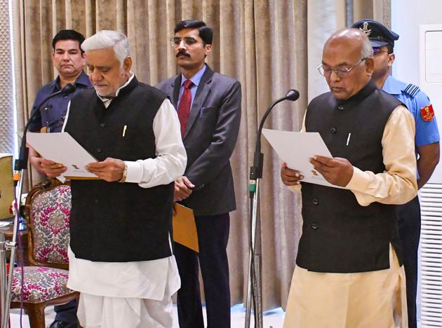 Haryana governor Satyadeo Narain Arya administers the oath of office and secrecy to Raghuvir Singh Kadian as the acting speaker of the Haryana Vidhan Sabha in Chandigarh, Monday.(PTI)