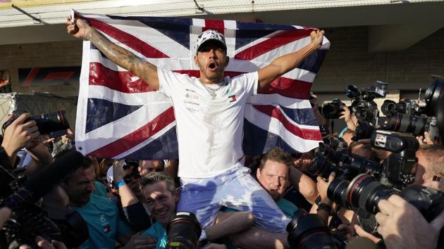 Mercedes driver Lewis Hamilton, of Britain, celebrates following the Formula One U.S. Grand Prix auto race at the Circuit of the Americas, Sunday, Nov. 3, 2019, in Austin, Texas. (AP) Mercedes driver Lewis Hamilton, of Britain, celebrates following the Formula One U.S. Grand Prix auto race at the Circuit of the Americas, Sunday, Nov. 3, 2019, in Austin, Texas. (AP)