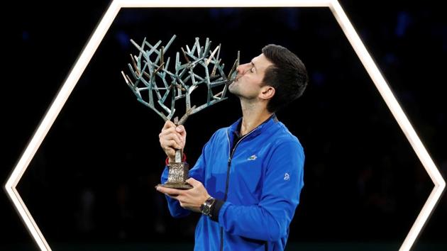 Novak Djokovic celebrates with the trophy after winning the Paris Masters. (REUTERS) Novak Djokovic celebrates with the trophy after winning the Paris Masters. (REUTERS)