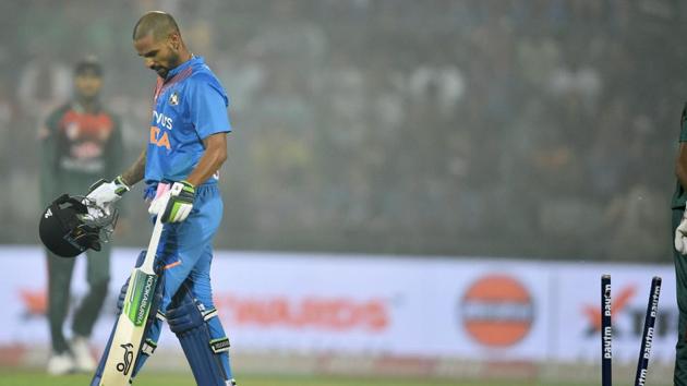 Shikhar Dhawan leaves the field after being dismissed during the first T20 match between Bangladesh and India.(PTI)