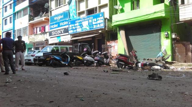 The blast took place in front of a grocery shop and some vehicles parked nearby were also damaged in the explosion. (HT Photo) The blast took place in front of a grocery shop and some vehicles parked nearby were also damaged in the explosion. (HT Photo)