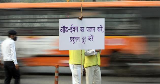 Volunteers from Civil Defence wearing anti pollution masks seen with placards at Laxmi Nagar crossing, in New Delhi. The third edition of the odd-even road space rationing drive saw fewer prosecutions on Monday compared to the first day of the previous arrangement in April, 2016. The Delhi government said since it was the first day of the drive, officials were asked to go soft on violators and instead make them understand about the rule. (Raj K Raj / HT Photo)