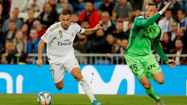Real Madrid's Eden Hazard in action with Leganes' Rodrigo Tarin.(REUTERS)