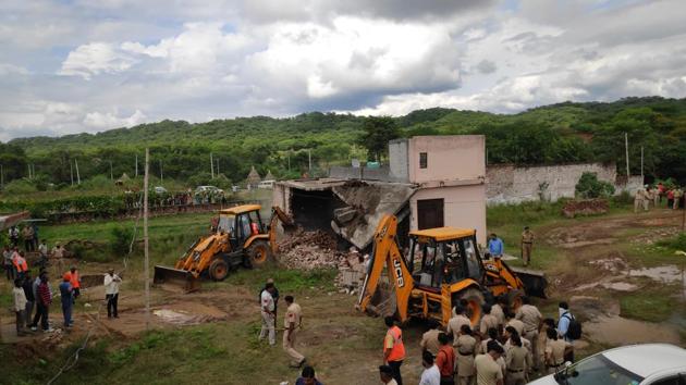 A demolition drive being carried out at a farmhouse constructed in the Sukhna catchment area in September 2019. (HT FILE) A demolition drive being carried out at a farmhouse constructed in the Sukhna catchment area in September 2019. (HT FILE)