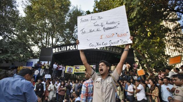 The protest came three days after a dispute over a lawyer parking his car near the police lock-up in Tis Hazari court complex in north Delhi turned into a violent clash between the police and lawyers. As per police records, the clash left 21 policemen and eight lawyers injured. On Monday, lawyers chased and attacked policemen, journalists and civilians in and around the district courts in south Delhi’s Saket. A video showed lawyers slapping and elbowing a policeman and vandalising police property. (Burhaan Kinu / HT Photo)