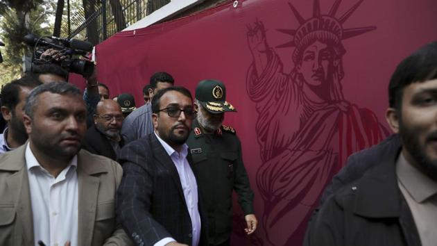Chief of Iran's Revolutionary Guard Gen. Hossein Salami, center, attends a ceremony to unveil new anti-U.S. murals painted on the walls of former U.S. embassy in Tehran, Iran, Saturday, Nov. 2, 2019. (AP)