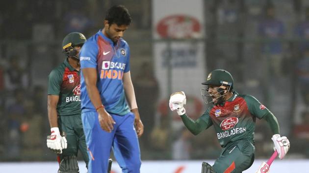 Bangladesh's Mushfiqur Rahim, right, celebrates after wining first T20 cricket match against India.(AP)