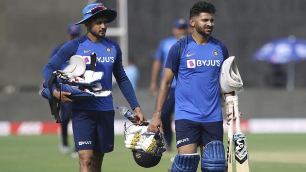 Shreyas Iyer, right and Manish Pandey return after a practice session.(AP)