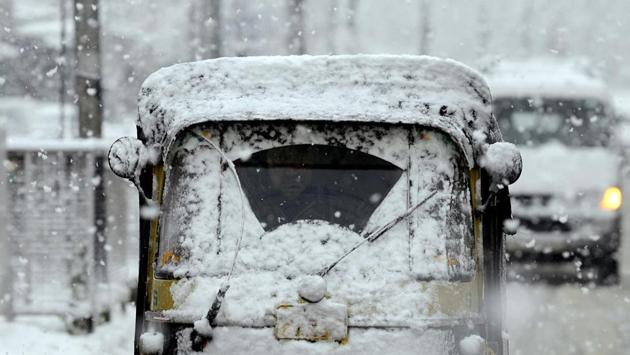 Traffic on the Jammu-Srinagar highway was hit because of the heavy snowfall at the north portal of Jawahar tunnel on the Qazigund side of Kashmir. The Mughal Road in Rajouri was also closed due to snowfall in the Pir Panjal range. (ANI)