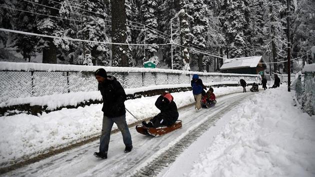 Kashmiri men pull tourists on a sleigh on a snow-covered road, in Gulmarg. In neighbouring Himachal Pradesh, the Leh-Manali highway was closed due to snowfall at Rohtang Pass. Kangra was the wettest place in Himachal Pradesh with 11mm of rainfall, while Seobagh in Kullu got 8.2 mm of rainfall. The minimum temperature in Shimla dropped to 5.6 degrees Celsius and Manali recorded a day temperature of 3.6 degrees Celsius. (ANI)