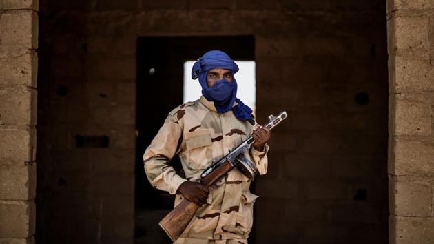 A Fulani militiaman poses with his weapon, a Soviet made PPSh-41, at an informal demobilisation camp in Sevare. The violence in Mali, in turn, has spread to neighbouring Niger and Burkina Faso, stirring anxiety among the coastal states of West Africa that they could be next in line. (Marco Longari / AFP)