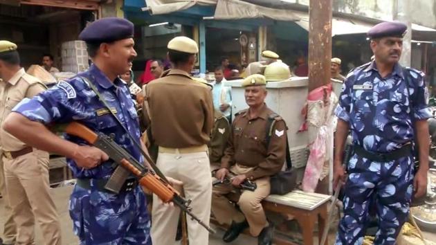 Police and paramilitary personnel stand guard as the security situations tighten in Ayodhya on Wednesday. (ANI Photo) Police and paramilitary personnel stand guard as the security situations tighten in Ayodhya on Wednesday. (ANI Photo)