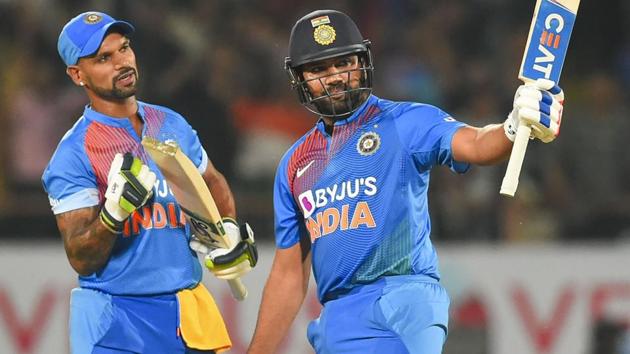 Rohit Sharma raises his bat after scoring fifty.(PTI)