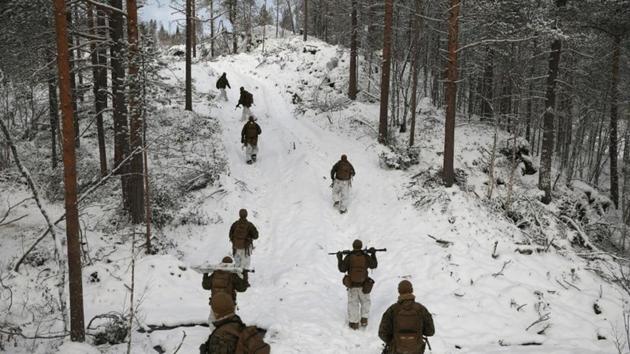 Under a soft winter sun US Marines train in snow as they learn how to fight in the freezing cold. “Which country is to the northeast?” Staff Sergeant Daniel Croak bellows at a group of 20 soldiers in camouflaged combat jackets and white trousers in a pine forest near the town of Setermoen. “Russia!” they shout back. The troops are part of a contingent of 650 Marines staging a recent joint military exercise with NATO-member Norway. (Stoyan Nenov / REUTERS) Under a soft winter sun US Marines train in snow as they learn how to fight in the freezing cold. “Which country is to the northeast?” Staff Sergeant Daniel Croak bellows at a group of 20 soldiers in camouflaged combat jackets and white trousers in a pine forest near the town of Setermoen. “Russia!” they shout back. The troops are part of a contingent of 650 Marines staging a recent joint military exercise with NATO-member Norway. (Stoyan Nenov / REUTERS)