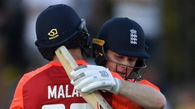 Dawid Malan and Eoin Morgan embrace each other during Napier T20I.(England/ Twitter)