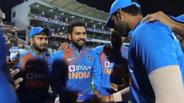 Rohit Sharma was handed over his 100th T20I cap by Shivam Dube(Twitter)