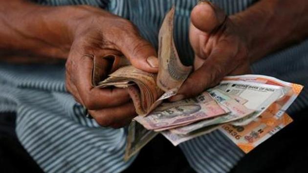 Rupee declined the most in Asia, while sovereign bonds and stocks saw modest losses after Moody’s Investors Services lowered the nation’s rating outlook to negative citing growth concerns. (REUTERS) Rupee declined the most in Asia, while sovereign bonds and stocks saw modest losses after Moody’s Investors Services lowered the nation’s rating outlook to negative citing growth concerns. (REUTERS)