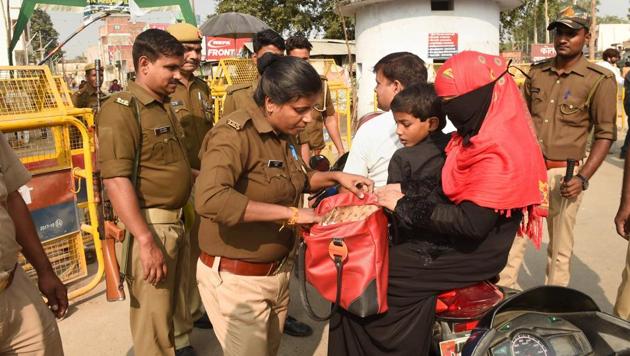 Police personnel conduct searches near the site of disputed Ram Janambhoomi-Babri Masjid site, as the verdict date nears, in Ayodhya. (Photo: PTI) Police personnel conduct searches near the site of disputed Ram Janambhoomi-Babri Masjid site, as the verdict date nears, in Ayodhya. (Photo: PTI)