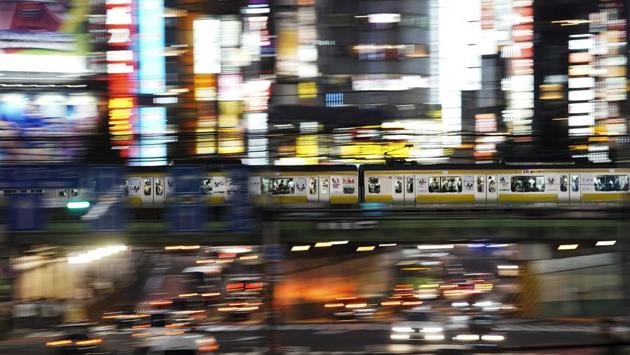 A train packed with commuters travels through the Shinjuku district of Tokyo during evening rush hours. Japanese professor Azuma Taguchi at Chuo University has researched Tokyo’s system for years and says it’s already running at double its capacity and the Olympic crunch could push it to the breaking point. “When peak capacity is twice or three times above normal, it’s possible some people could be killed,” Taguchi said. (Jae C. Hong / AP) A train packed with commuters travels through the Shinjuku district of Tokyo during evening rush hours. Japanese professor Azuma Taguchi at Chuo University has researched Tokyo’s system for years and says it’s already running at double its capacity and the Olympic crunch could push it to the breaking point. “When peak capacity is twice or three times above normal, it’s possible some people could be killed,” Taguchi said. (Jae C. Hong / AP)