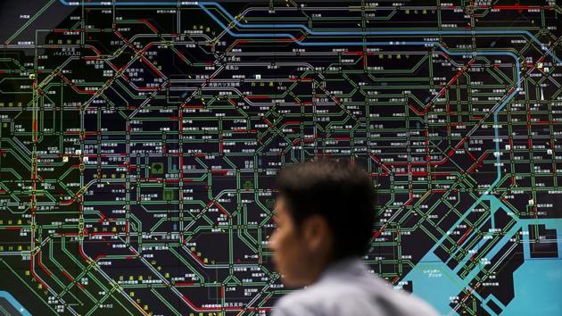 An officer monitors the flow of public transportation in front of a screen showing Tokyo’s web of train lines at the Tokyo Metropolitan Police Department’s traffic control centre. First, Tokyo Olympic fans will have to find scarce tickets and pay the price. And the summer heat and humidity will be off-putting for some. Then there’s one more hurdle: getting around, or even finding a tiny space to stand on Tokyo’s famously efficient but over-stressed rail system. (Jae C. Hong / AP) An officer monitors the flow of public transportation in front of a screen showing Tokyo’s web of train lines at the Tokyo Metropolitan Police Department’s traffic control centre. First, Tokyo Olympic fans will have to find scarce tickets and pay the price. And the summer heat and humidity will be off-putting for some. Then there’s one more hurdle: getting around, or even finding a tiny space to stand on Tokyo’s famously efficient but over-stressed rail system. (Jae C. Hong / AP)
