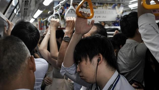 Tokyo’s Olympic organizing committee question Taguchi’s dire predictions. They acknowledge the railways will be packed with 800,000 added passengers daily. They also anticipate that Tokyo expressway congestion will double. Hoping to head off the crowding, the committee wants to launch a smartphone app, boost multilingual signage, and use boats and robot-assisted technology to help fans and commuters get around. As with all Olympics, authorities are testing special highway lanes and altering the city’s transit flow. (Jae C. Hong / AP) Tokyo’s Olympic organizing committee question Taguchi’s dire predictions. They acknowledge the railways will be packed with 800,000 added passengers daily. They also anticipate that Tokyo expressway congestion will double. Hoping to head off the crowding, the committee wants to launch a smartphone app, boost multilingual signage, and use boats and robot-assisted technology to help fans and commuters get around. As with all Olympics, authorities are testing special highway lanes and altering the city’s transit flow. (Jae C. Hong / AP)