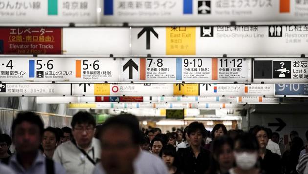 Commuters make their way through a tunnel underneath the clusters of platform signs at Shinjuku Station. Taguchi’s computer simulation predicts that the biggest wave of Olympic spectators will collide with work commuters at popular transfer stations during the morning rush hour, while small stations closest to venues will be overwhelmed. Add to the mix, newcomers carrying luggage aboard subway cars and struggling to maneuver off the train and through crowded stations. (Jae C. Hong / AP) Commuters make their way through a tunnel underneath the clusters of platform signs at Shinjuku Station. Taguchi’s computer simulation predicts that the biggest wave of Olympic spectators will collide with work commuters at popular transfer stations during the morning rush hour, while small stations closest to venues will be overwhelmed. Add to the mix, newcomers carrying luggage aboard subway cars and struggling to maneuver off the train and through crowded stations. (Jae C. Hong / AP)