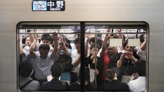 Tokyo University professor Katsuhiro Nishinari is working with the organising committee on what he calls “jam-ology” — the study of crowd behavior. “We’re used to having one game per day at the stadium, but during Olympics its 3-4 games in one day” “We have to exchange the audience 2-3 times. That’s where we don’t have experience.” “We’re explaining to all the companies and the media, asking people not to work during those weeks,” Nishinari said. “Just enjoy the Olympics.” (Jae C. Hong / AP) Tokyo University professor Katsuhiro Nishinari is working with the organising committee on what he calls “jam-ology” — the study of crowd behavior. “We’re used to having one game per day at the stadium, but during Olympics its 3-4 games in one day” “We have to exchange the audience 2-3 times. That’s where we don’t have experience.” “We’re explaining to all the companies and the media, asking people not to work during those weeks,” Nishinari said. “Just enjoy the Olympics.” (Jae C. Hong / AP)