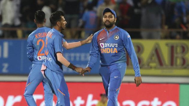 Indian player Yuzvendra Chahal congratulates Rohit Sharma who took a catch to dismiss Bangladesh's Afif Hossain during the second Twenty20 international cricket match between India and Bangladesh in Rajkot, India, Thursday, Nov. 7, 2019.(AP)