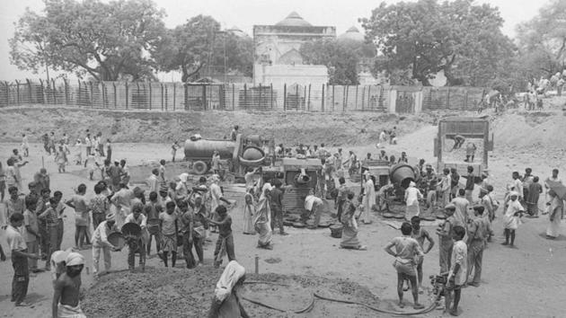Workers begin the construction work for the Ram temple on July 09, 1992. Hindu groups formed a committee in 1984 to lead the construction of a Ram temple at the Janmabhoomi site and the movement gathered momentum under BJP leader Lal Krishna Advani. In 1989, the Vishwa Hindu Parishad (VHP) laid the foundation of a Ram temple on the land next to the Babri Masjid. (Rajiv Gupta / HT Archive)