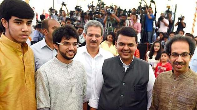 Devendra Fadnavis along with Sena chief Uddhav Thackeray and his sons Tejas and Aditya (PTI) Devendra Fadnavis along with Sena chief Uddhav Thackeray and his sons Tejas and Aditya (PTI)