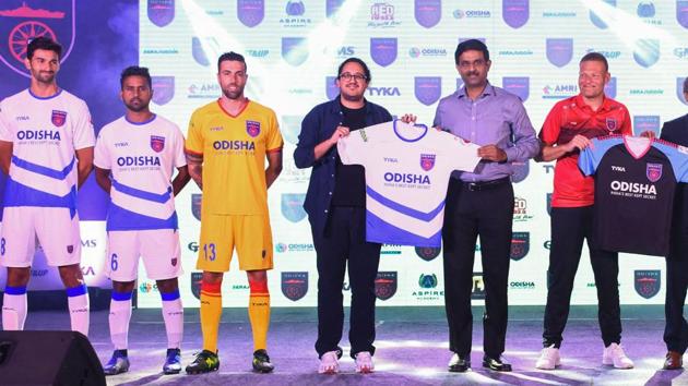 Odisha football team players and officials launch their home jersey of Odisha FC ahead of ISL 2019, in Bhubaneswar.(PTI)