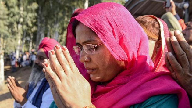 A Sikh devotee offers prayers as she looks towards the Shrine of Baba Guru Nanak Dev at Gurdwara Darbar Sahib. The historic opening of the Kartarpur Sahib Corridor offers a great opportunity for the Sikh community to bring India and Pakistan together in these testing times, the leader of the UAE’s Sikh community has said, thanking the leaders of both the countries for the momentous occasion. (Narinder Nanu / AFP) 