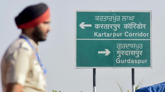Police personnel stand guard during the inauguration ceremony of the corridor. A day before its opening, confusion and controversy swirled around the Corridor, with Indian officials blaming this on actions by Pakistani authorities. There was confusion as Pakistan’s foreign office first said Prime Minister Imran Khan’s decision to waive the $20 service fee for Indian pilgrims on November 9 and 12 had been withdrawn, and then announced the waiver would be implemented on the two days. (Narinder Nanu / AFP) 
