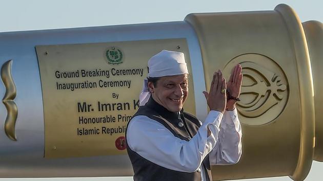 Pakistan’s Prime Minister Imran Khan claps after inaugurating the ceremony at the Shrine of Baba Guru Nanak Dev. In his message on the occasion of Kartarpur Sahib Corridor’s opening, the PM Khan said, “we believe that the road to prosperity of region and bright future of our coming generation lies in peace,” “Today we are not only opening the border, but also our hearts for the Sikh community,” he said. (Aamir Qureshi / AFP) 