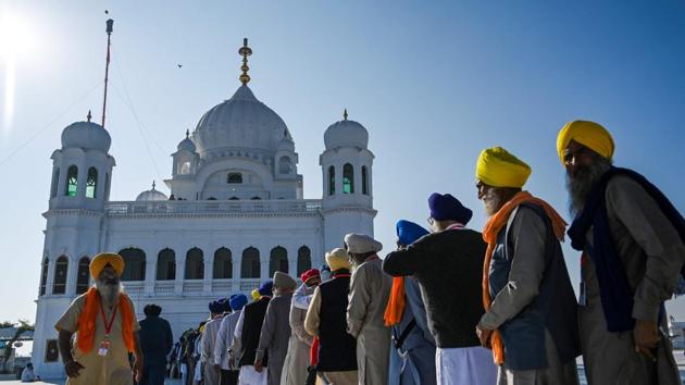Sikh Pilgrims stand in a queue to visit the Shrine of Baba Guru Nanak Dev at Gurdwara Darbar Sahib. Guru Nanak Dev had spent 14 years of his early life at Sultanpur Lodhi and used to take daily bath in the holy Kali Bein. (Aamir Qureshi / AFP) 