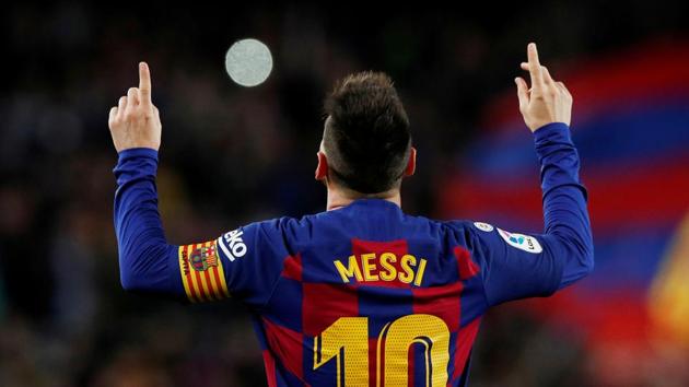 Barcelona's Lionel Messi celebrates scoring their second goal.(REUTERS)