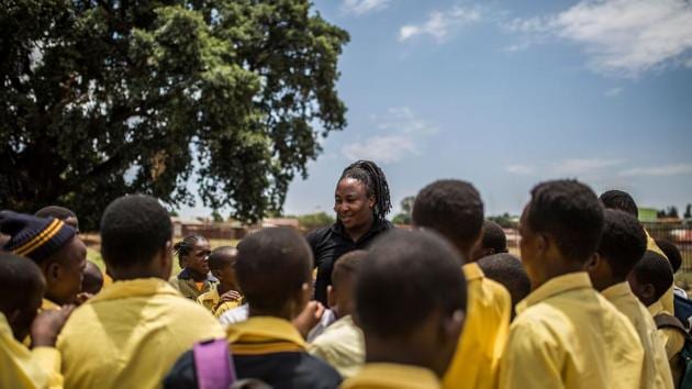 Chris Litau (C), coach of the Soweto Rugby School Academy addresses at his students from Prudence High School. Not so long ago black people, oppressed by the apartheid system, despised the Springboks, a team which for decades excluded non-whites. “The rugby team came to symbolise the arrogance of Afrikaner power,” says Bongani Dlamini, a retired teacher from Soweto. (Guillem Sartorio / AFP) Chris Litau (C), coach of the Soweto Rugby School Academy addresses at his students from Prudence High School. Not so long ago black people, oppressed by the apartheid system, despised the Springboks, a team which for decades excluded non-whites. “The rugby team came to symbolise the arrogance of Afrikaner power,” says Bongani Dlamini, a retired teacher from Soweto. (Guillem Sartorio / AFP)