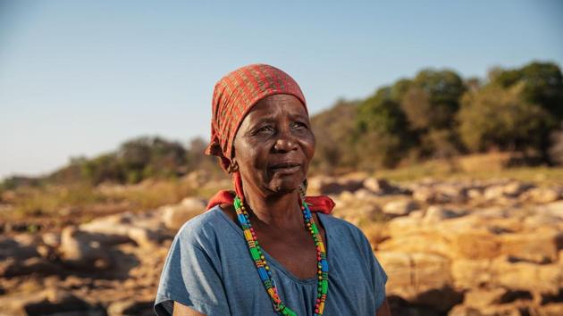 On winter mornings, elderly women from the local Tsonga community reach down to the earth, scraping up soil blanketed by a shiny white, thin crystallised deposit. “This is a sacred place, given to us by our ancestors,” said 73-year-old harvester Emelin Mathebula, teasing salty soil onto a metal plate with a steel rod. (Michele Spatari / AFP) On winter mornings, elderly women from the local Tsonga community reach down to the earth, scraping up soil blanketed by a shiny white, thin crystallised deposit. “This is a sacred place, given to us by our ancestors,” said 73-year-old harvester Emelin Mathebula, teasing salty soil onto a metal plate with a steel rod. (Michele Spatari / AFP)