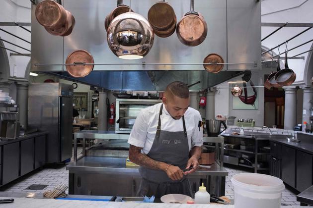 Germaine Esau, Chef de cuisine at the Myoga fine-dining restaurant, uses Baleni salt to prepare a dish of seared tuna, preserved plum Eugenia berries, shiso, radish and macadamia in Cape Town. “It’s like nothing you’ve tasted before,” he says. “It brings all the flavours out and just lifts everything,” he adds. (Michele Spatari / AFP) Germaine Esau, Chef de cuisine at the Myoga fine-dining restaurant, uses Baleni salt to prepare a dish of seared tuna, preserved plum Eugenia berries, shiso, radish and macadamia in Cape Town. “It’s like nothing you’ve tasted before,” he says. “It brings all the flavours out and just lifts everything,” he adds. (Michele Spatari / AFP)
