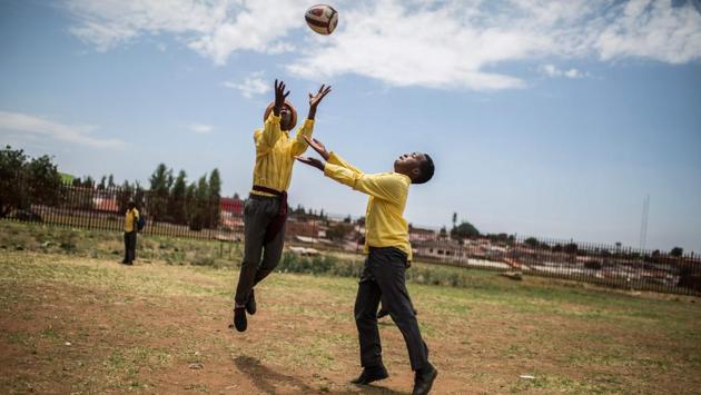 Players from the Soweto Rugby School Academy warm up before practice in Soweto. These players are part of the Soweto Rugby School Academy (SRSA), one of the three rugby schools of Soweto, a black township of Johannesburg housing more than 1.3 million people. Founded in 2016 the SRSA has some 250 students of age between 8 and 19, of which almost 50 are girls. (Guillem Sartorio / AFP) Players from the Soweto Rugby School Academy warm up before practice in Soweto. These players are part of the Soweto Rugby School Academy (SRSA), one of the three rugby schools of Soweto, a black township of Johannesburg housing more than 1.3 million people. Founded in 2016 the SRSA has some 250 students of age between 8 and 19, of which almost 50 are girls. (Guillem Sartorio / AFP)