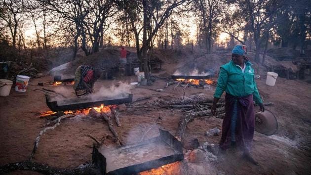 Josephine Macete, 48, oversees salt-rich water boiling on the bank of the Klein Letaba River. Baleni salt is used in numerous luxury restaurants across Cape Town and Johannesburg, where it retails for 125 rand ($8.24, 7.49 euros) per kilo. At the Myoga, Baleni salt became the salt of choice after the restaurant decided to phase out imported products and go for local sources. (Michele Spatari / AFP) Josephine Macete, 48, oversees salt-rich water boiling on the bank of the Klein Letaba River. Baleni salt is used in numerous luxury restaurants across Cape Town and Johannesburg, where it retails for 125 rand ($8.24, 7.49 euros) per kilo. At the Myoga, Baleni salt became the salt of choice after the restaurant decided to phase out imported products and go for local sources. (Michele Spatari / AFP)