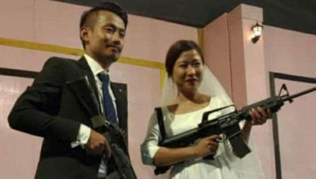 Guests at a wedding reception in Nagaland’s Dimapur were taken aback last Saturday when the groom and his bride started posing for photographs with automatic assault rifles. (HT Photo) Guests at a wedding reception in Nagaland’s Dimapur were taken aback last Saturday when the groom and his bride started posing for photographs with automatic assault rifles. (HT Photo)
