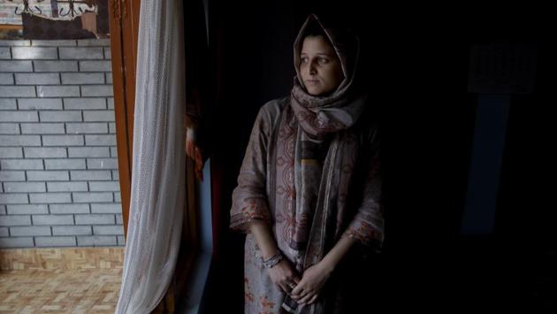 Newly married Kulsuma Rameez, 24, looks out of a window inside her home on the outskirts of Srinagar. Kulsuma says she was unable to shop for her wedding and borrowed her wedding dress from a relative. Her ceremony was small, attended by a few relatives and next-door neighbours. After the ceremony, she walked half a kilometer to her new home as the roads were blocked. (Dar Yasin / AP) Newly married Kulsuma Rameez, 24, looks out of a window inside her home on the outskirts of Srinagar. Kulsuma says she was unable to shop for her wedding and borrowed her wedding dress from a relative. Her ceremony was small, attended by a few relatives and next-door neighbours. After the ceremony, she walked half a kilometer to her new home as the roads were blocked. (Dar Yasin / AP)