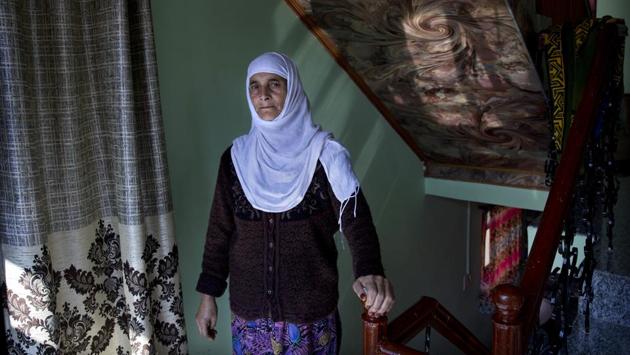 A Kashmiri woman Biba Malla is seen inside her house on the outskirts of Srinagar. Malla’s cousin died on August 31, but she was informed about it almost a week later. “I missed the funeral and the condolence meeting, which is held on the fourth day and is very important for us. Our men folk still haven’t visited fearing detention by police on the way to our relative’s home,” she said. (Dar Yasin / AP) A Kashmiri woman Biba Malla is seen inside her house on the outskirts of Srinagar. Malla’s cousin died on August 31, but she was informed about it almost a week later. “I missed the funeral and the condolence meeting, which is held on the fourth day and is very important for us. Our men folk still haven’t visited fearing detention by police on the way to our relative’s home,” she said. (Dar Yasin / AP)